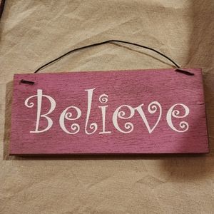 3.5x8" wood sign saying BELIEVE.
